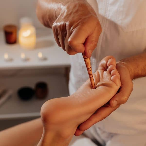 Practitioner giving a therapy session