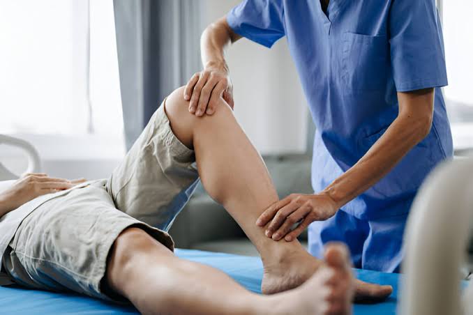 Physiotherapist working with a patient